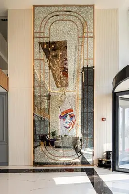 a lobby with a painting on the wall at Calisi Hotel in Belgrade