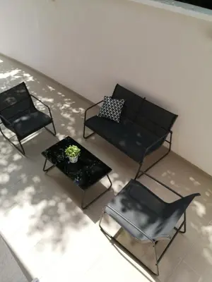a living room with two chairs and a couch and a table at Dimiant Lux Apartment in Vračar (historical)