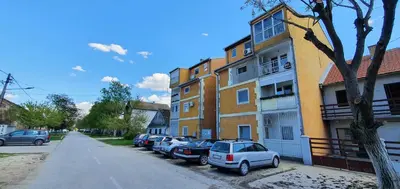 a row of cars parked in front of a building at Julija 3 in Pančevo
