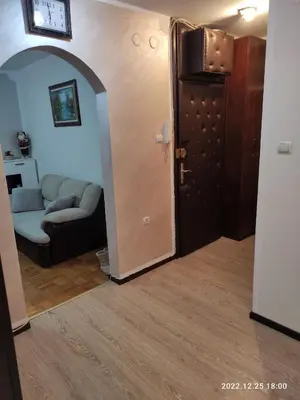 a living room with a couch and a door at Stan na dan in Resnik