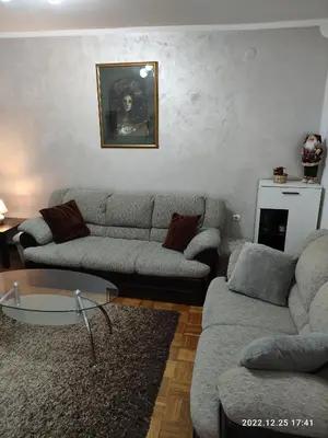 a living room with two couches and a coffee table at Stan na dan in Resnik