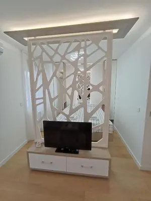 a living room with a tv on a dresser at Galija apartment in Belgrade