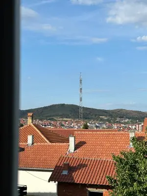 a view of the roofs of buildings with a antenna at Apartman Dunja in Arandjelovac