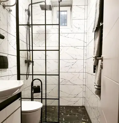 a bathroom with a shower with a toilet and a sink at Gorila 1 in Voždovac