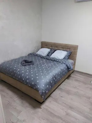 a bed sitting in a room with at Apartman mikikiki in Belgrade