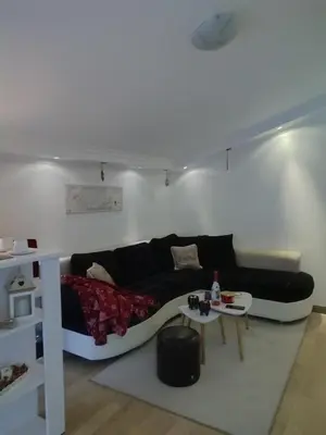 a living room with a couch and a table at Apartman K2 in Žarkovo