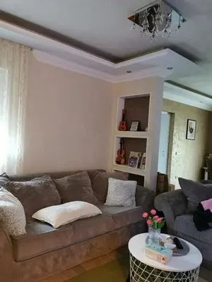 a living room with a couch and a table at Lux apartman Lena in Belgrade