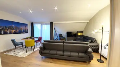 a living room with a couch and a table at Apart Hotel Maksimum in Belgrade