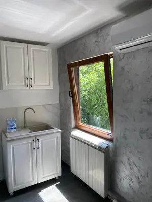 a kitchen with a sink and a window at Apartman17 in Belgrade