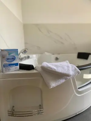 a bathroom with a toilet and a sink and towels at Apartman17 in Belgrade