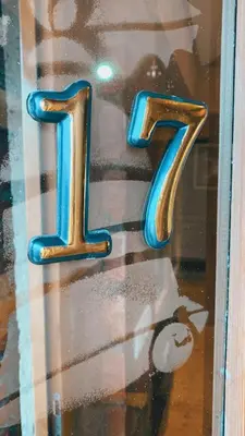 a glass window with the number on it at Apartman17 in Belgrade