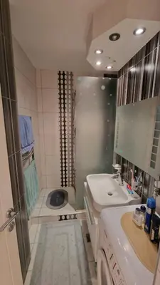 a bathroom with a shower and a sink and a toilet at Sava Centar in Novi Beograd