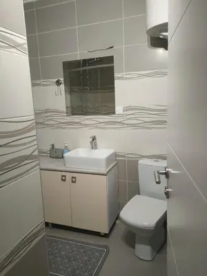 a bathroom with a toilet and a sink and a mirror at Kapetan Misina-Nina in Belgrade
