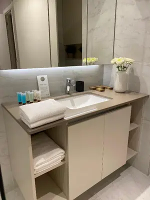 a bathroom with a sink and a mirror at DOM Boutique Apartments AURORA in Belgrade