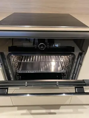 a toaster oven with its door open on a counter at DOM Boutique Apartments AURORA in Belgrade