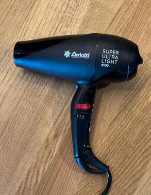 a hair dryer sitting on top of a table at DOM Boutique Apartments AURORA in Belgrade