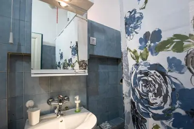 a bathroom with a sink and a mirror at Neimar Apartment with Great Wi-Fi and free parking in Belgrade