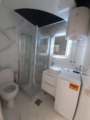 a bathroom with a toilet and a shower and a sink at Viktorija 1 in Čukarica