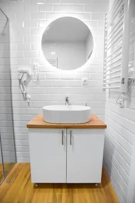 a white bathroom with a sink and a mirror at Premium Suites Terazije in Belgrade