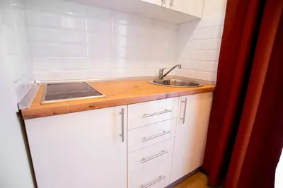 a small kitchen with a sink and a counter at Premium Suites Terazije in Belgrade