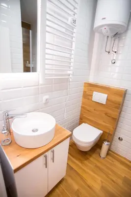 a white bathroom with a sink and a toilet at Premium Suites Terazije in Belgrade