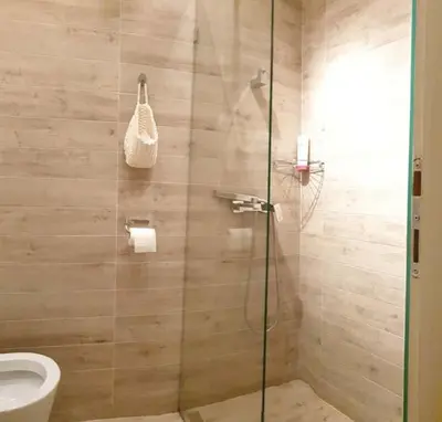 a bathroom with a shower with a toilet at STUDIO 77 in Belgrade
