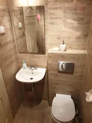 a small bathroom with a toilet and a sink at STUDIO 77 in Belgrade