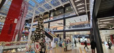 a christmas tree in the middle of a shopping mall at Old Town Apartments Rajiceva 3 in Belgrade