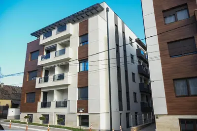 an apartment building on a street at Apartment Barcelona Zemun Belgrade in Zemun