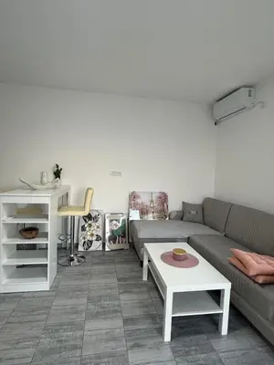 a living room with a couch and a table at Kares house in Belgrade
