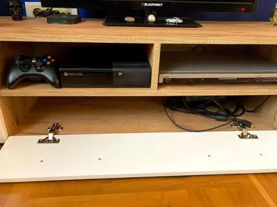 a shelf with a video game console and a video game controller at Amazing Memories in Belgrade
