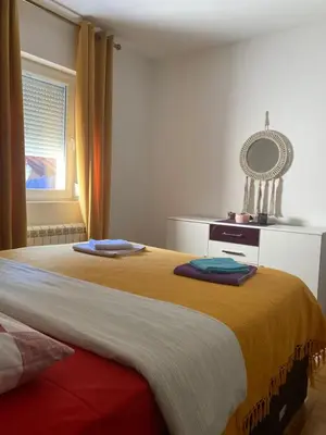 a bedroom with a bed with two towels on it at Amazing Memories in Belgrade