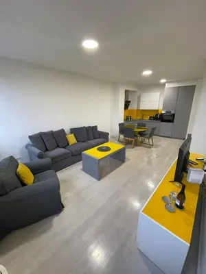 a living room with a couch and a table at Iskra in Karaburma