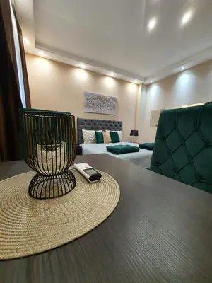 a room with a table with a cell phone on it at Emerald Apartment Belgrade in Senjak (historical)