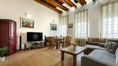a living room with a couch and a table at Old Port Lux RiverView Duplex in City Center in Belgrade