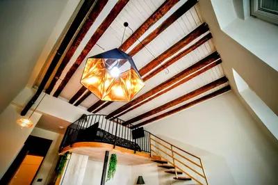 a chandelier hanging from the ceiling of a building at Old Port Lux RiverView Duplex in City Center in Belgrade