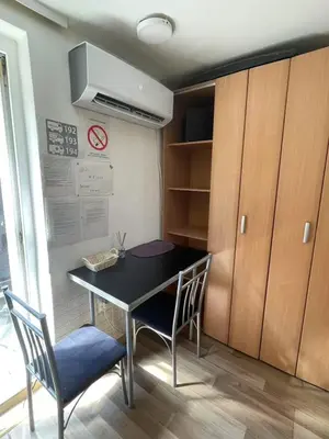 a dining room with a table and two chairs at Journey Home in Belgrade