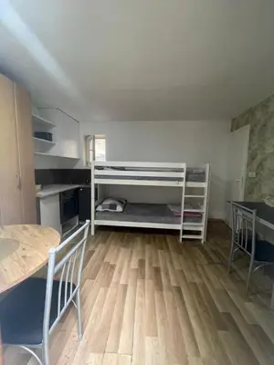 a room with a table and a table and chairs at Journey Home in Belgrade