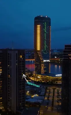 a view of a tall building in a city at night at Beograd na Vodi - BW ARCADIA LUXURY in Belgrade