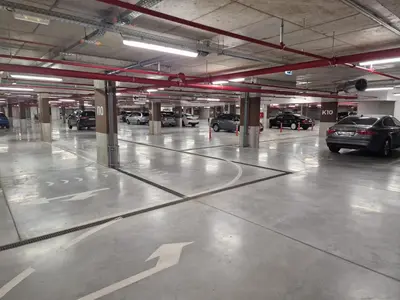 an empty parking garage with cars parked in it at Beograd na Vodi - BW ARCADIA LUXURY in Belgrade