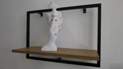 a white vase sitting on a shelf in front of a mirror at Fimiso in Borča