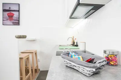 a kitchen with a sink and a counter top at Smart lux in Tošin Bunar