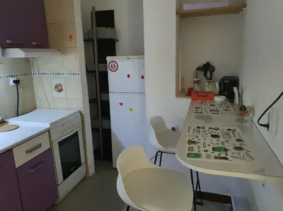 a small kitchen with a table and chairs in it at Sunflower apartment in Žarkovo