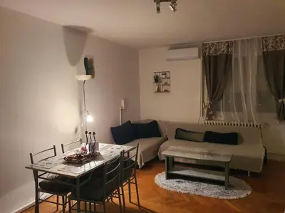 a living room with a couch and a table at Sunflower apartment in Žarkovo