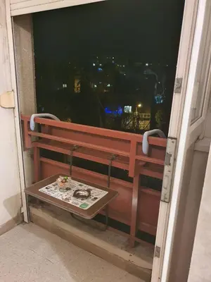 a bench on a balcony with a view of the city at Sunflower apartment in Žarkovo