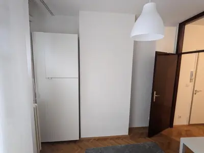 a kitchen with a white refrigerator in a room at Boba FREE PARKING in Zvezdara