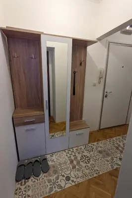 a room with a mirror and some shoes on a rug at Deja FREE PARKING in Zvezdara