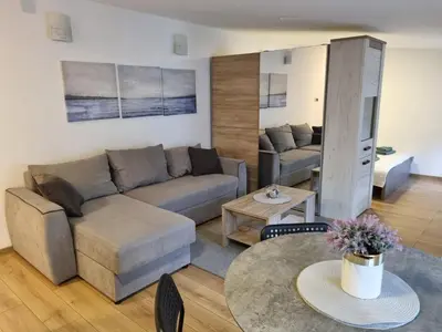 a living room with a couch and a table at Apartment S in Belgrade