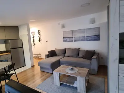 a living room with a couch and a table at Apartment S in Belgrade