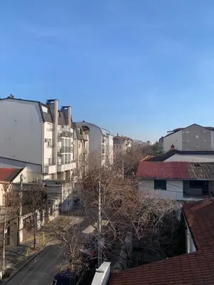a view of a city with buildings and trees at Vanja's place in Belgrade